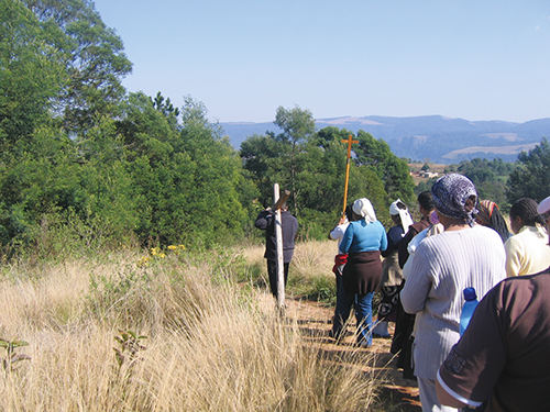 THE STRIKING South African countryside is the backdrop for an outdoor Stations of the Cross. The Stations resonate for South Africans, who daily struggle with the enormous death toll of AIDS.