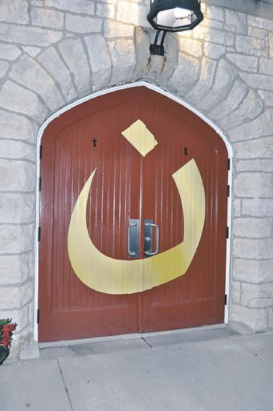 N for Nazarene Arabic character on Catholic Church door