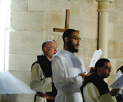 Abbot Paul Mark Schwan, O.C.S.O. (from left), Brother Luis Cortez, O.C.S.O., and Father Placid Morris, O.C.S.O. celebrate the completion of the medieval section of the rebuilt church.