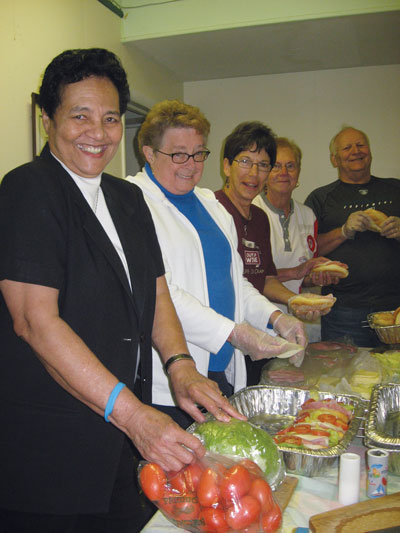 Muus and volunteers prepare hoagies