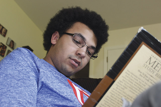 Young man reading the Bible