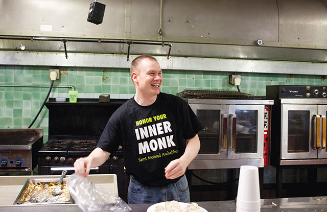 benedictine Brother James Jensen, O.S.B. helps at a food bank. 