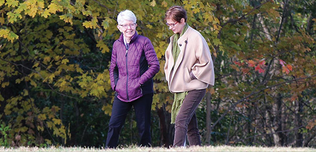 Sister Marsha Speth, S.P. (left) and Providence Associate candidate Mary Gemma take a walk during a retreat of the Providence Associates.