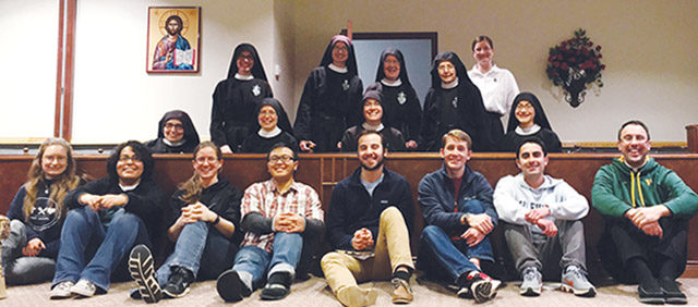 A group of retreatants share a few moments with the Passionist nuns at St. Joseph Retreat House near Whitesville, Kentucky.