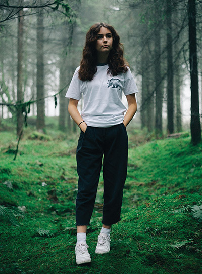 Young woman standing in the forest