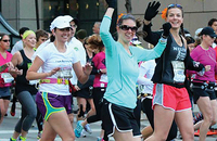 Three women running a race