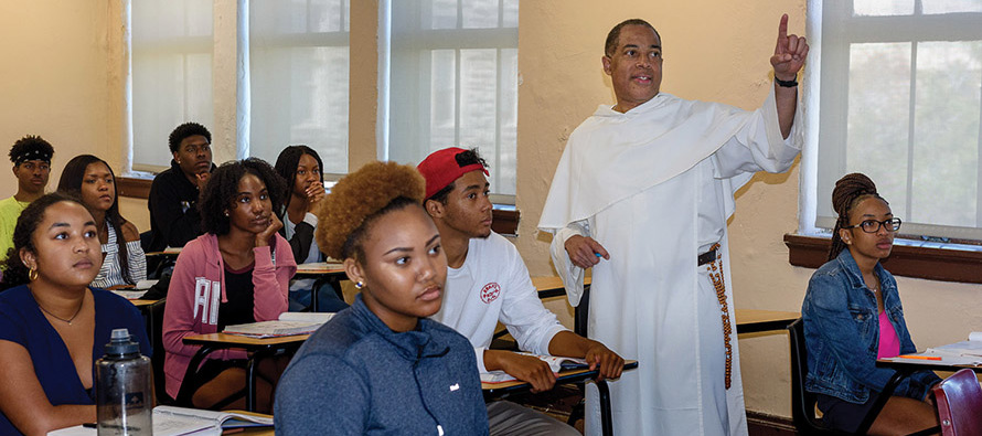 Brother Herman Johnson, O.P., leading the discussion with his college students, often fields questions about what it means to be a brother.