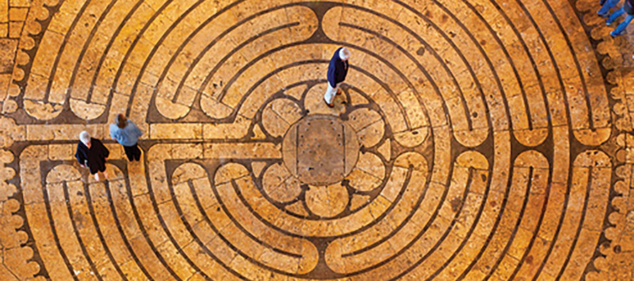 The stone-inlaid labyrinth in the nave of the 13th-century Chartres Cathedral