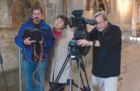 Sister Judy Zielinski, O.S.F. works with a crew filming murals in a church near Istanbul. 