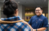 Brother Allen A. Pacquing, S.M. chats with a student at St. Mary’s University in San Antonio, Texas