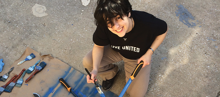 Sister Karina Conrad, C.D.P. volunteering during an alternative spring break event in Baltimore.